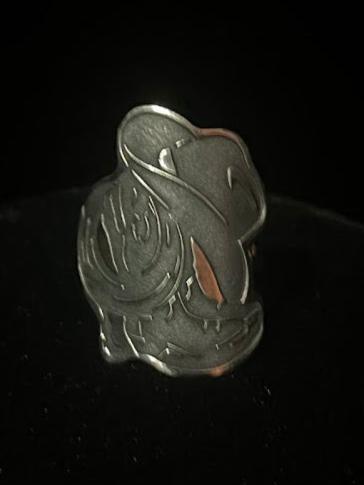 Cowboy hat ring — front view of the lasered boots, rope and hat design in sterling silver on black velvet
