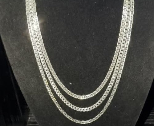 DESMOS curb chain necklace in rhodium-plated sterling silver draped on a black velvet bust at Regul Silver
