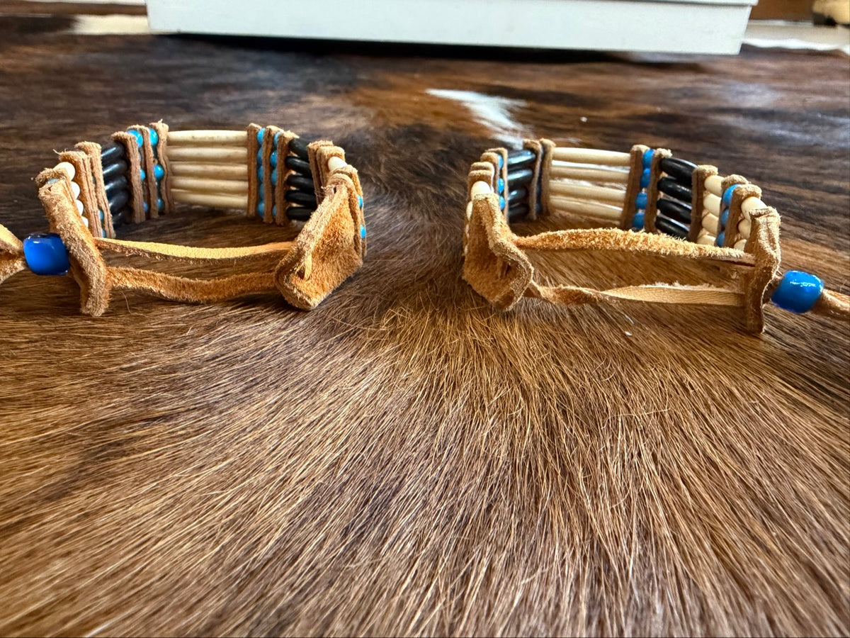 Leather tie fastener with blue bead on Southwest by Design hairpipe bracelet