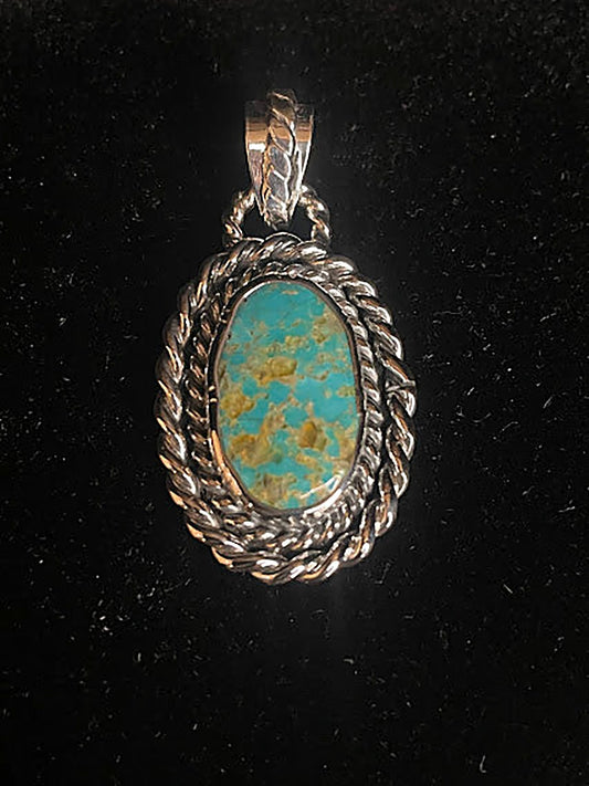 Genuine turquoise pendant - front view of the tall oval stone, blue-green with tan gold-brown matrix, in double rope
