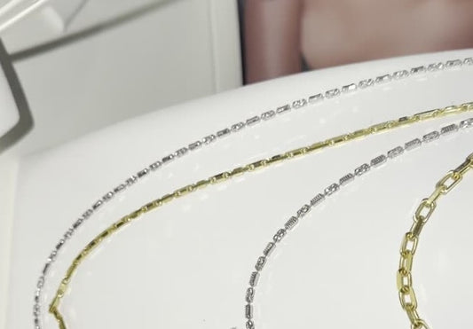 DESMOS barrel link necklace in rhodium-plated sterling silver, photographed in the DESMOS case at Regul Silver