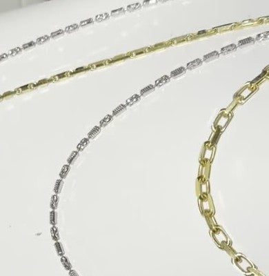 DESMOS fine barrel link necklace in rhodium-plated sterling silver, photographed in the DESMOS case at Regul Silver