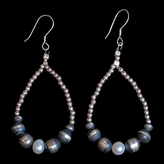 Navajo pearl earrings with baroque pearls - the pair straight on, white baroque pearl at the base of each teardrop
