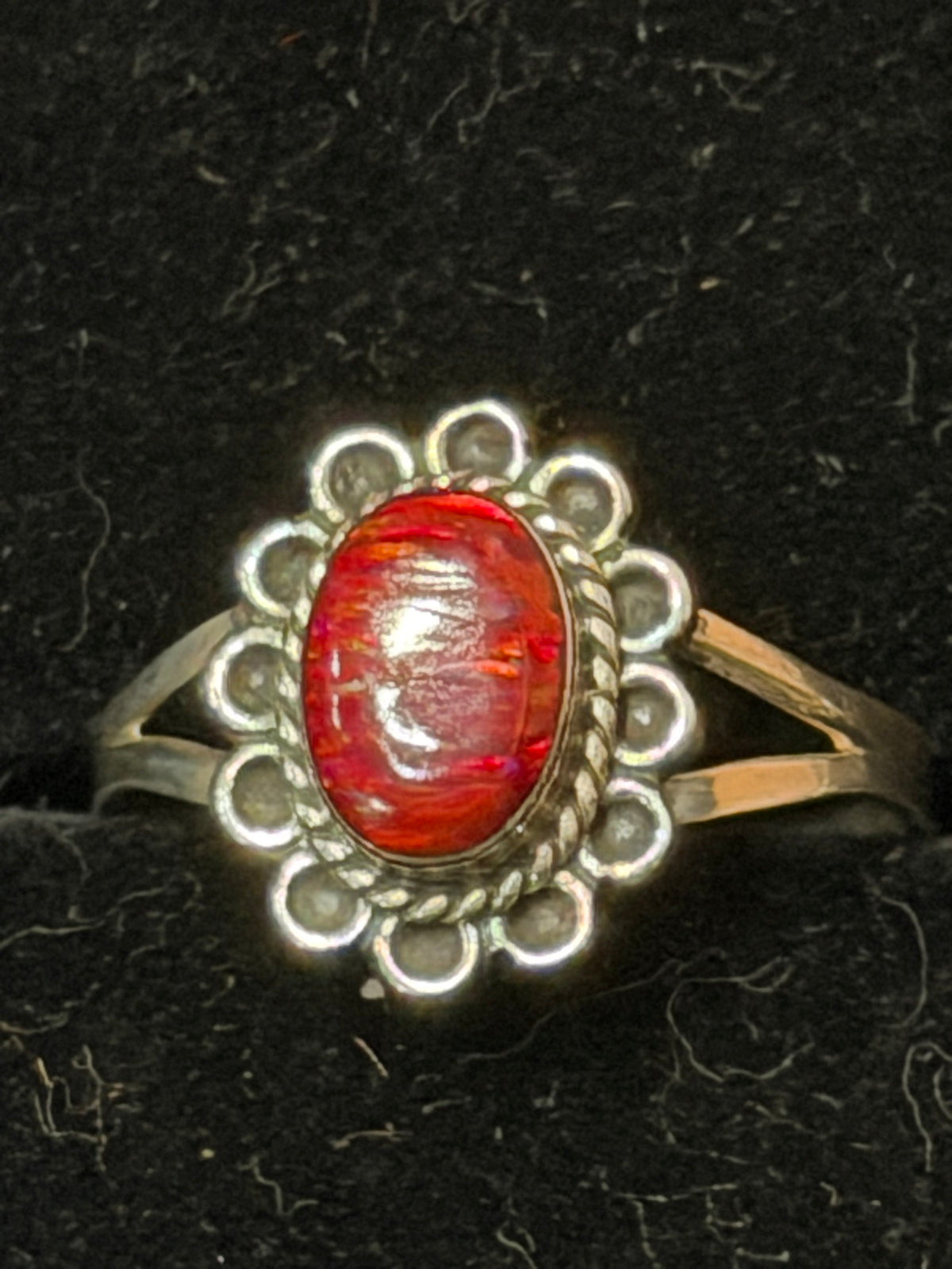 Opalite ring — red oval handmade opalite in a rope and scallop bezel on a sterling silver split shank