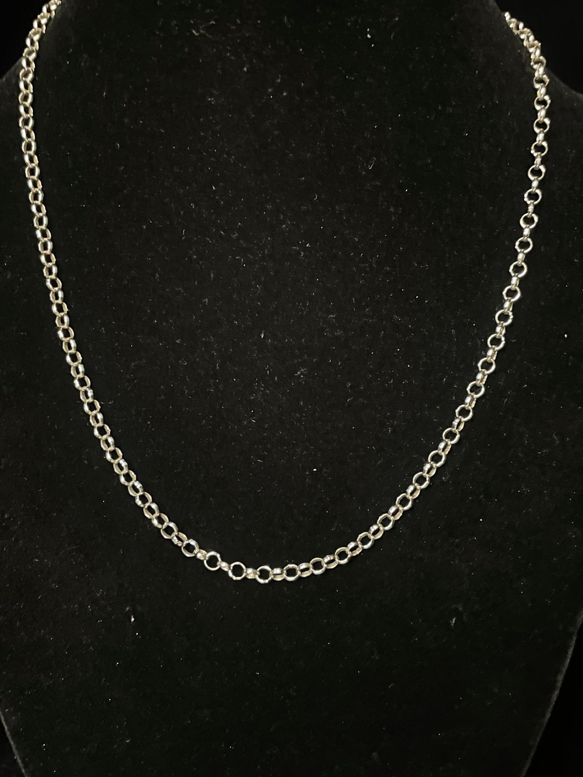 Sterling silver chain — the rolo chain on a black bust, a second view of its round links
