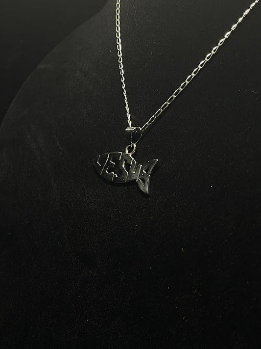 Sterling silver Jesus fish pendant on a black display bust, JESUS cut through the fish, showing how the pendant wears