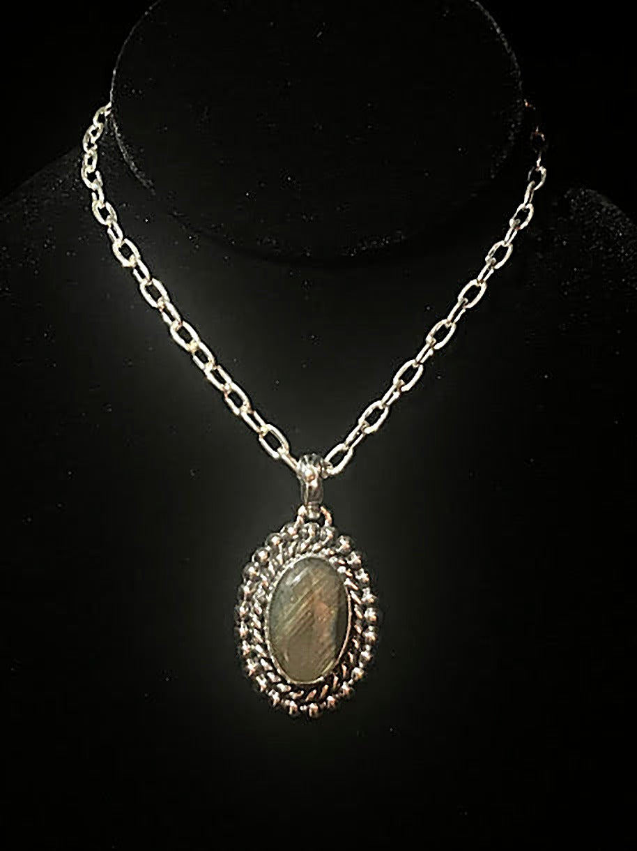Sterling silver oval labradorite necklace - large oval stone in a rope and beaded frame on its chain, on black