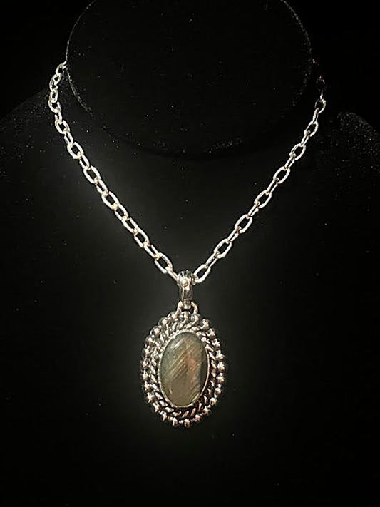 Sterling silver oval labradorite necklace - large oval stone in a rope and beaded frame on its chain, on black