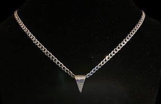 Not this necklace - a different sterling silver triangle pendant on a curb chain, shown on a black bust