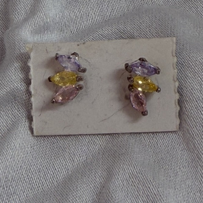 Multi-stone marquise cubic zirconia stud earrings in purple, yellow, and pink on black background