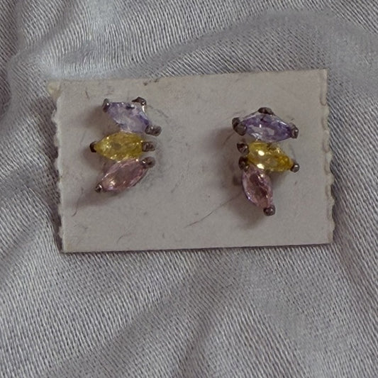 Multi-stone marquise cubic zirconia stud earrings in purple, yellow, and pink on black background