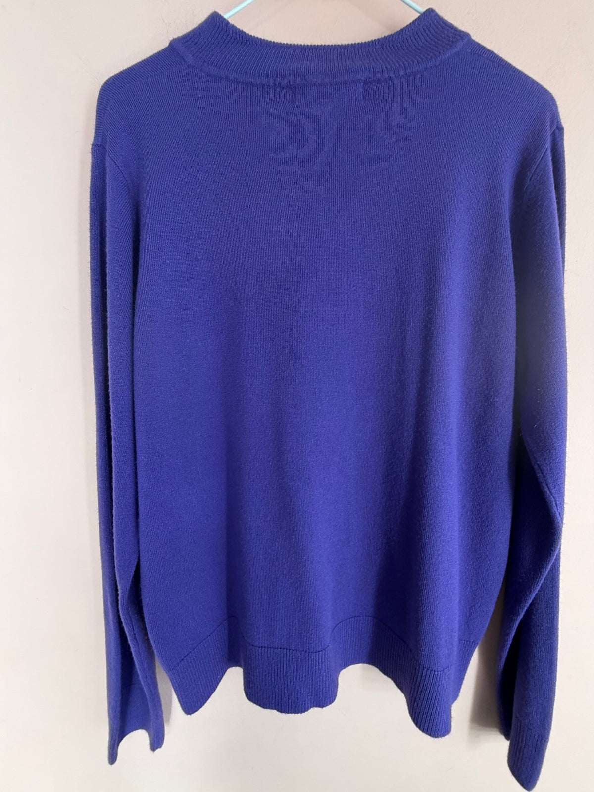 TCU purple mock neck knit sweater on hanger, back view