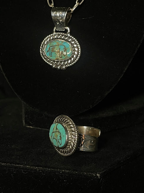 Turquoise buffalo ring — both forms in one frame, the necklace hanging above the adjustable ring