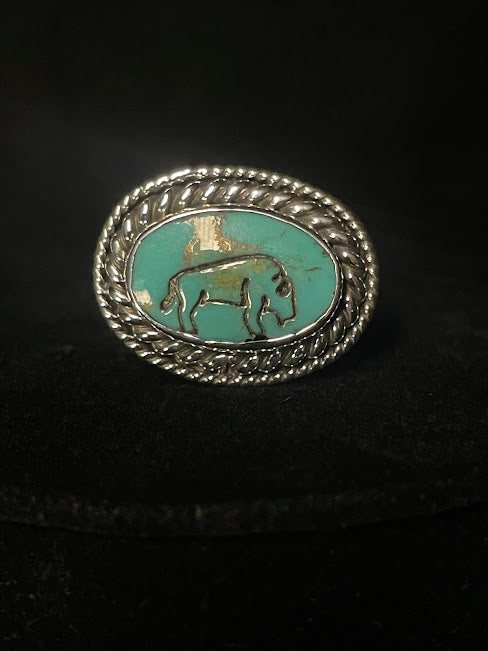 Turquoise buffalo ring — front view of the genuine turquoise stone in its double rope bezel, sterling silver
