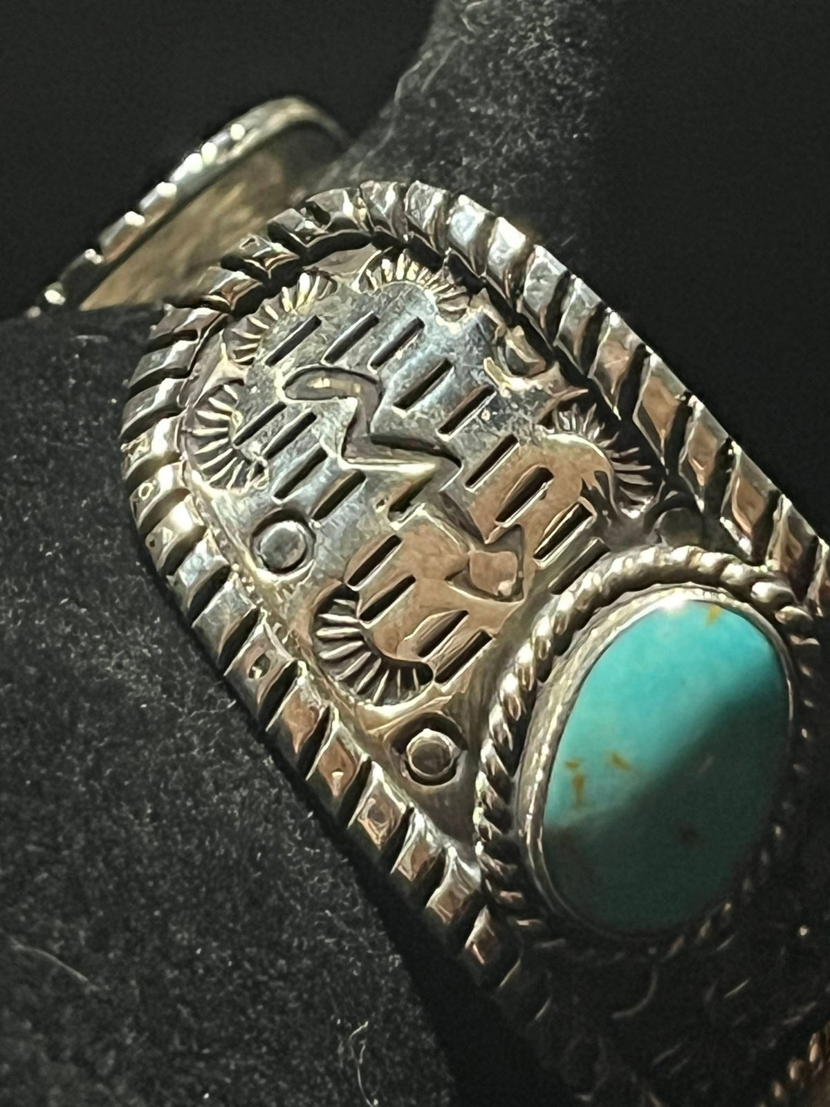 Turquoise cuff — stamped band detail with one bright blue oval turquoise stone and twisted rope edging