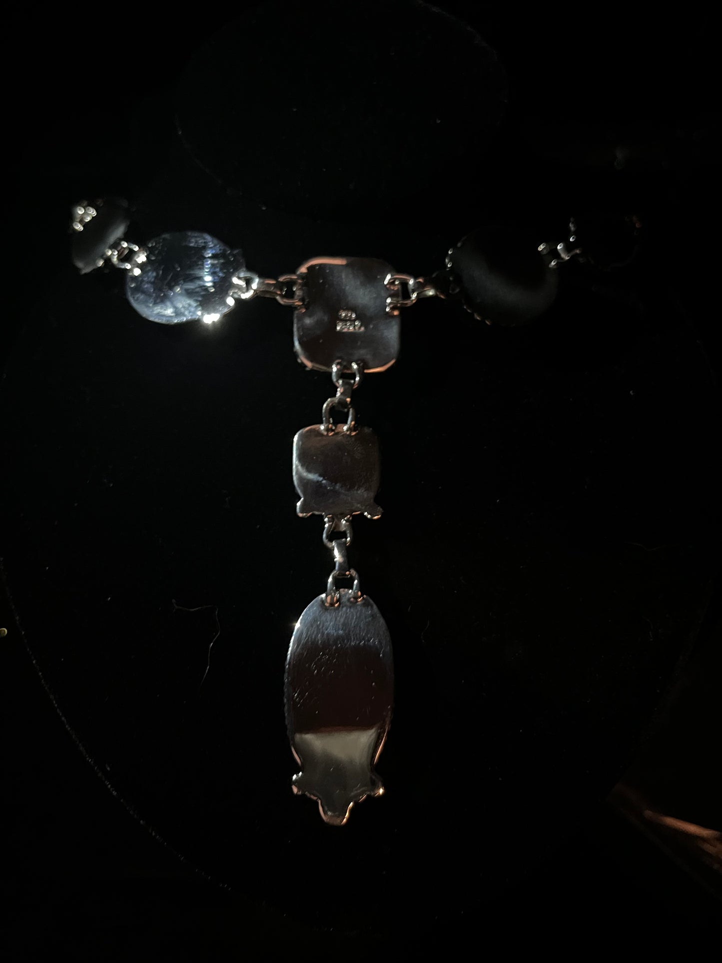 Turquoise lariat necklace — plain sterling silver backs of the stones, the 925 stamp showing on the center plate
