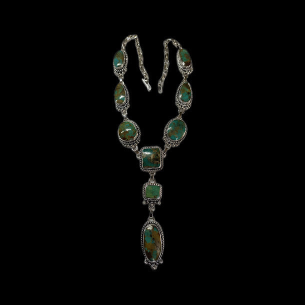 Turquoise lariat necklace — the full mixed-stone necklace on black, round side stones and an oval drop stone