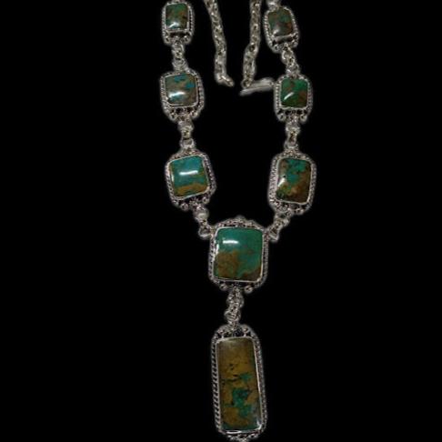 Turquoise lariat necklace — square turquoise stones with heavy brown matrix in sterling silver, full view on black