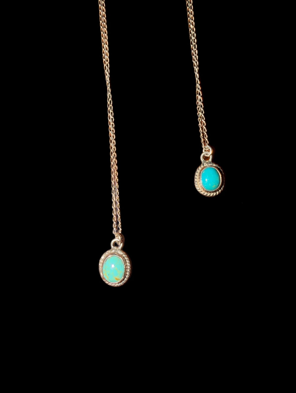 Genuine Oval Turquoise Pendant Necklace with classic bezel and rope surround on black background - Regul Silver
