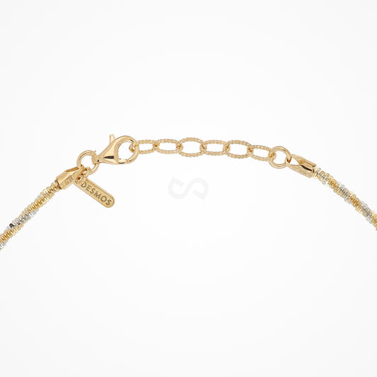 DESMOS twisted cable choker necklace in two-tone sterling silver with 18K gold plate, clasp, extender, and tag close on white